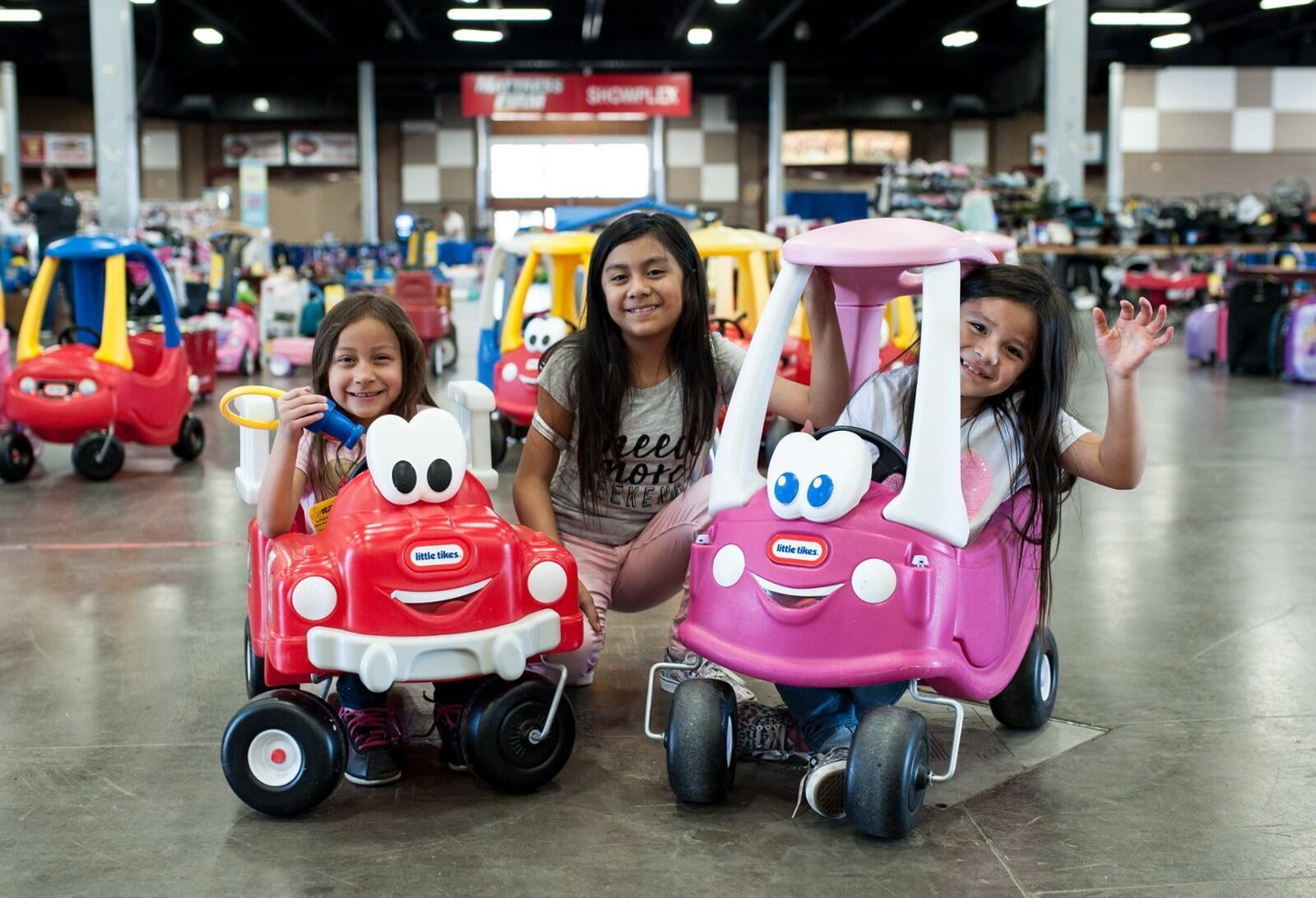 Three Kids Riding in Cozy Coupe Cars