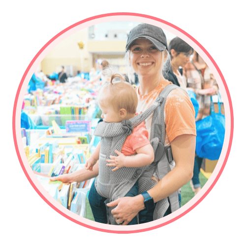 A mom, abuela and granddaughter attend a JBF sale in Dallas. Abuela is holding a babyseat.